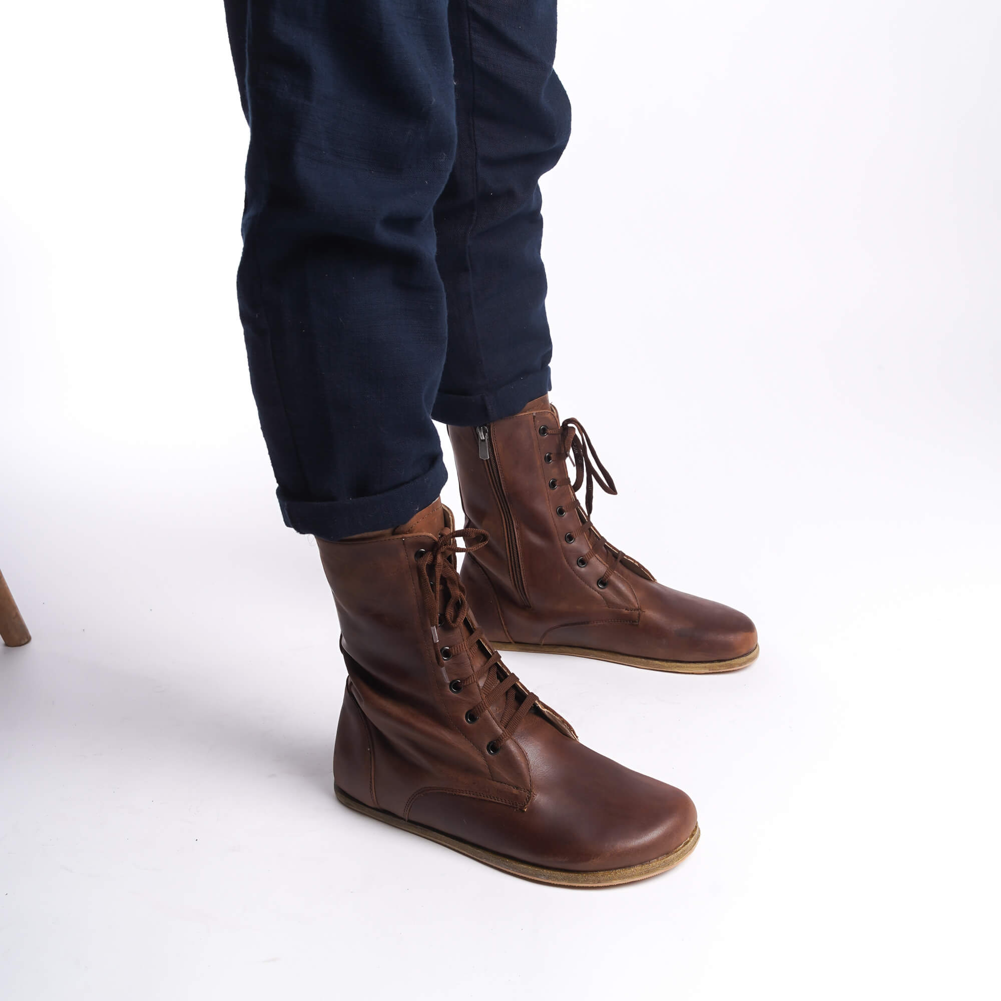 Side view of men's brown barefoot boots, highlighting the high-quality leather and lace-up design.