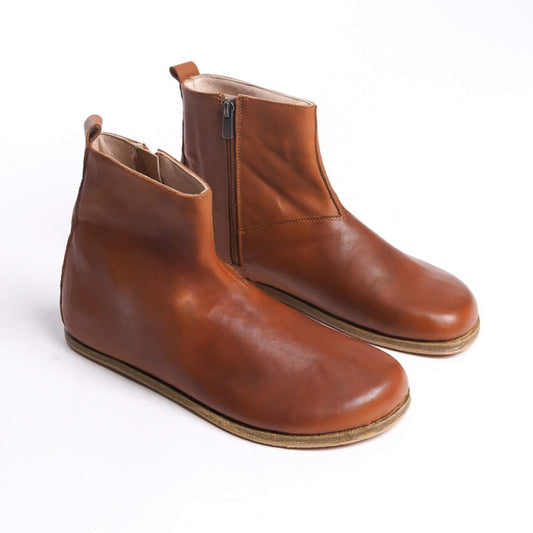 Pair of men's tan brown ankle boots, made from genuine leather with a side zipper for a chic and comfortable fit.