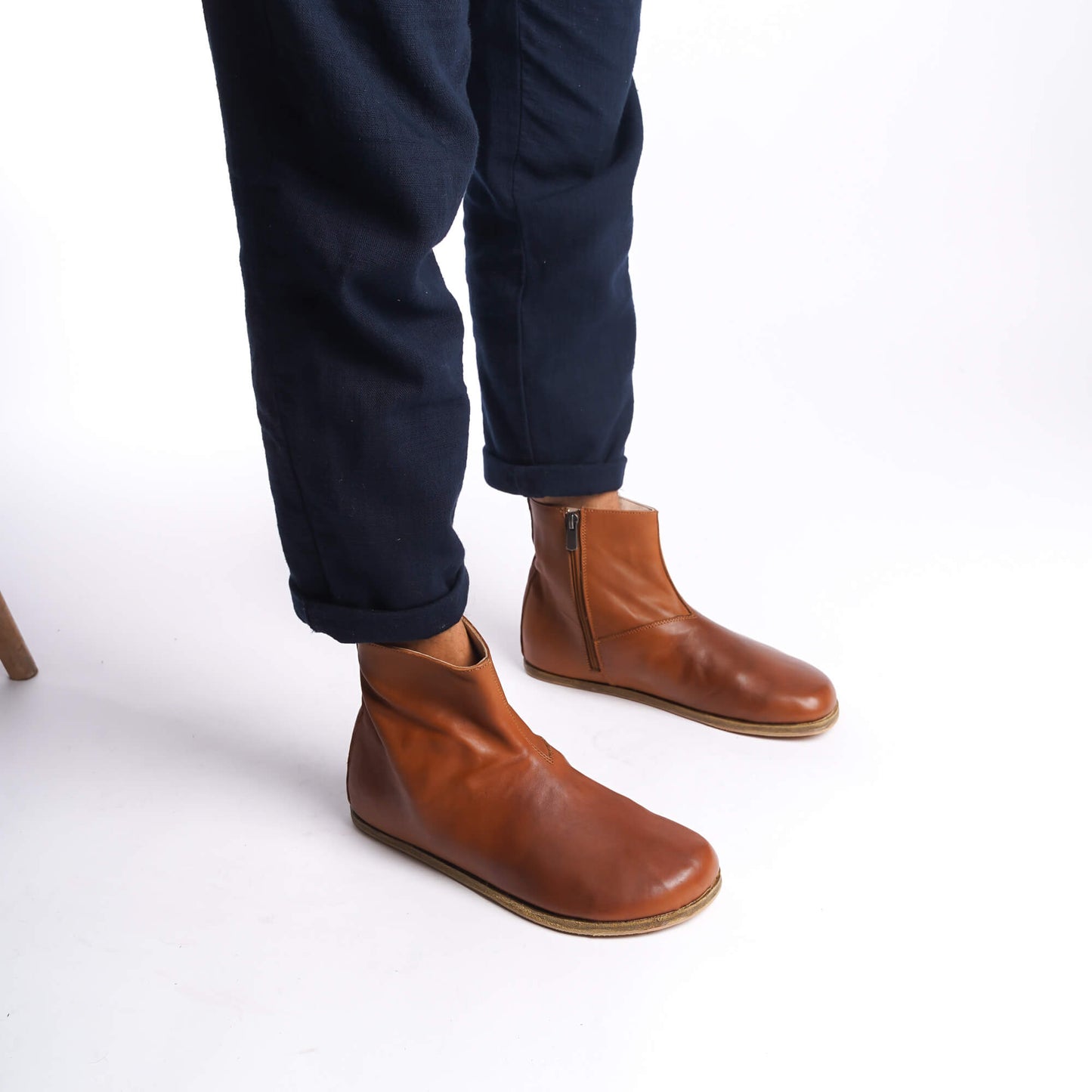 Tan brown leather barefoot ankle boots for men, perfect for winter, with a stylish zipper detail.