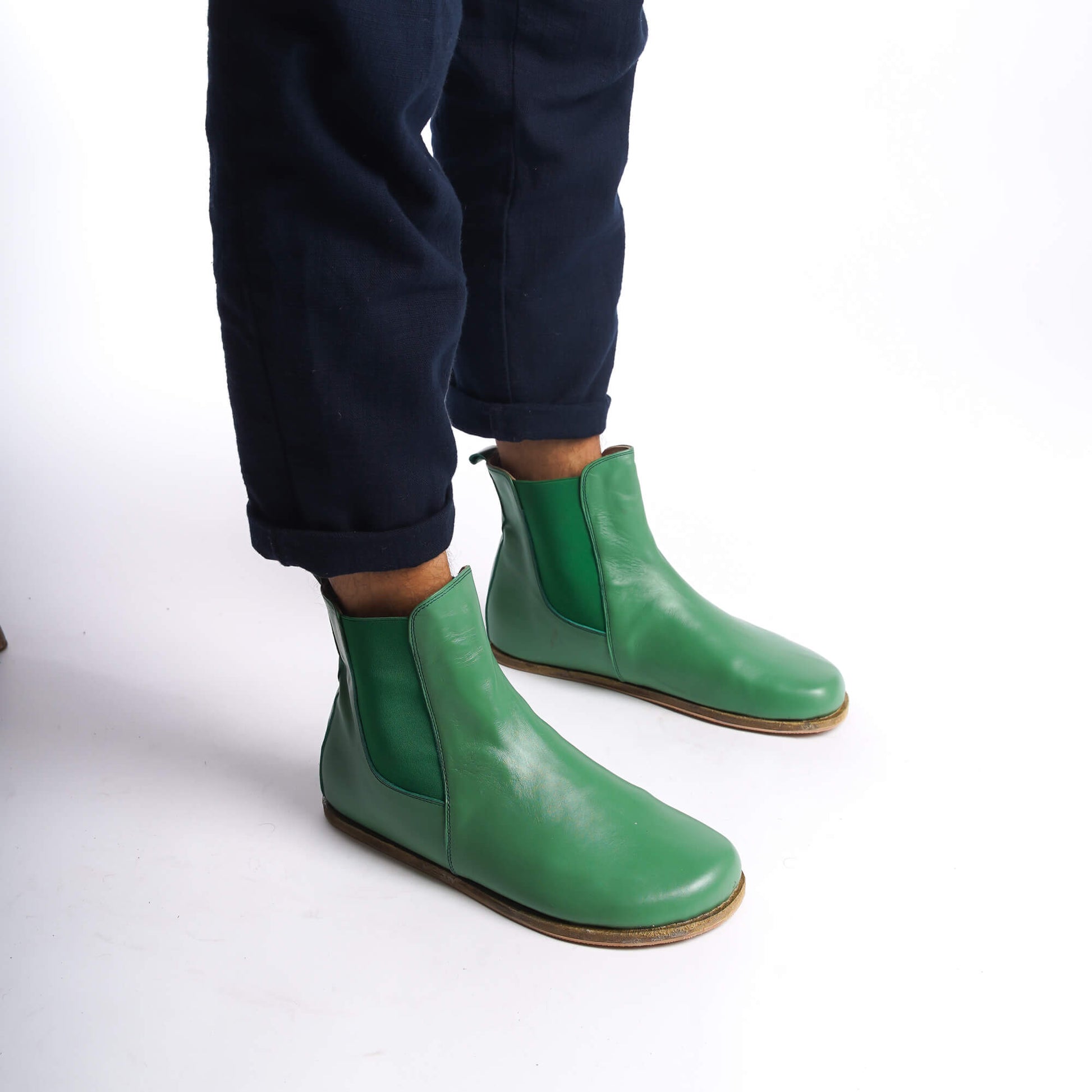 Green leather Chelsea boots for men, perfect for making a unique style statement, with a slip-on design.