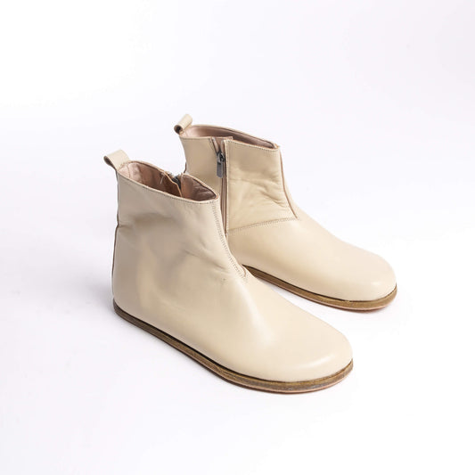 Pair of men's beige-cream ankle boots, made from genuine leather with a side zipper for a stylish and comfortable fit.