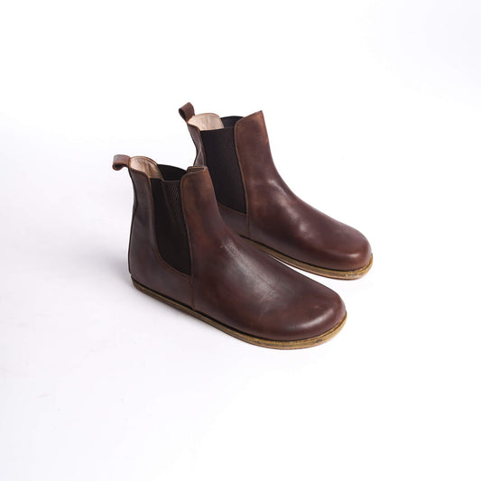 Pair of men's brown Chelsea boots, made from genuine leather with elastic side panels for a comfortable fit.