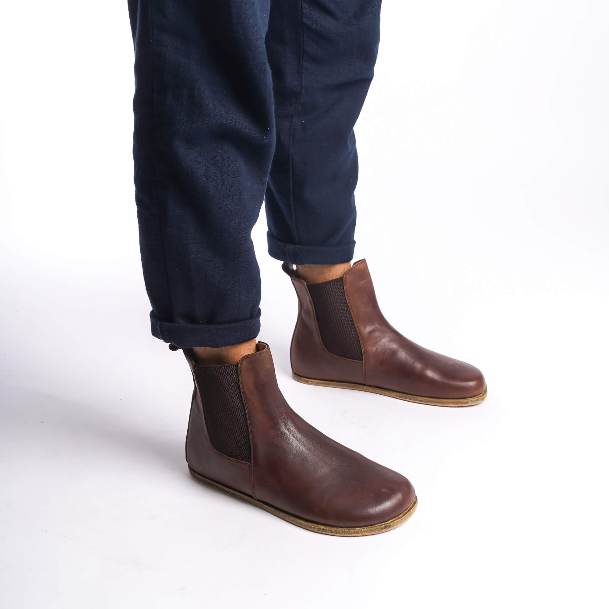 Brown leather Chelsea boots for men, perfect for casual or formal wear, with a convenient slip-on design.