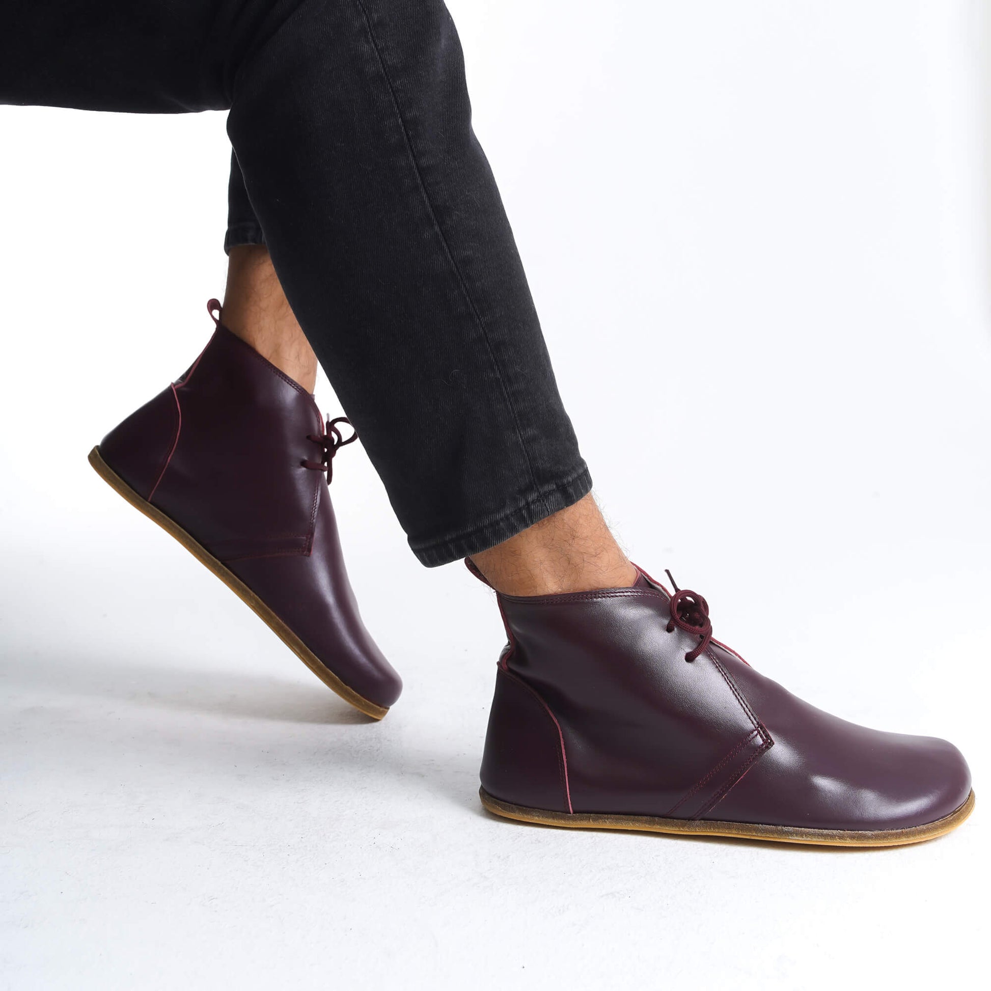 Burgundy barefoot leather ankle boots with flexible zero-drop sole, perfect for a health-conscious, minimalist lifestyle in the USA.