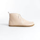 Beige minimalist leather barefoot boots with flexible zero-drop sole.