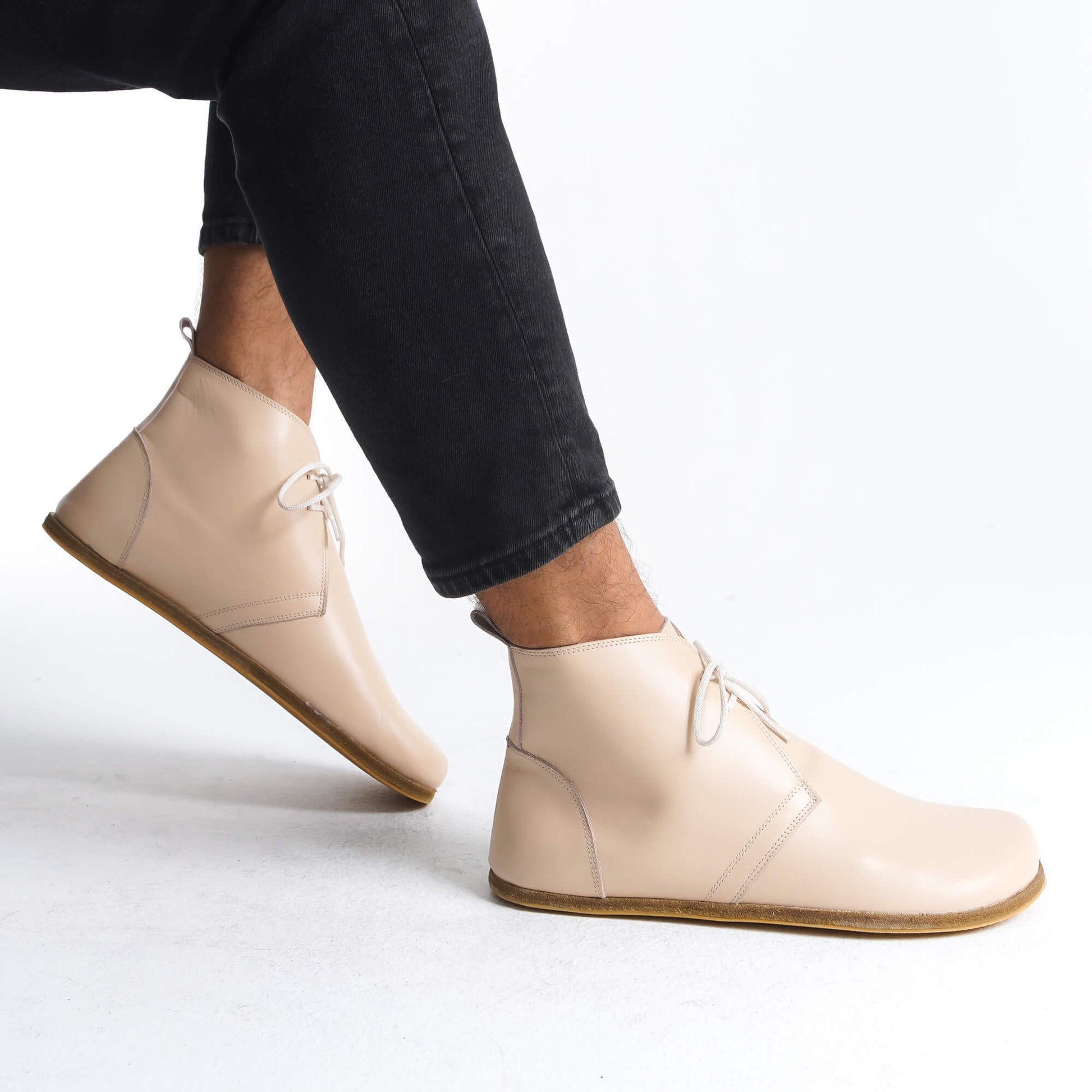 Comfortable and stylish beige barefoot ankle boots with zero-drop design, ideal for health-conscious, minimalist lifestyle.