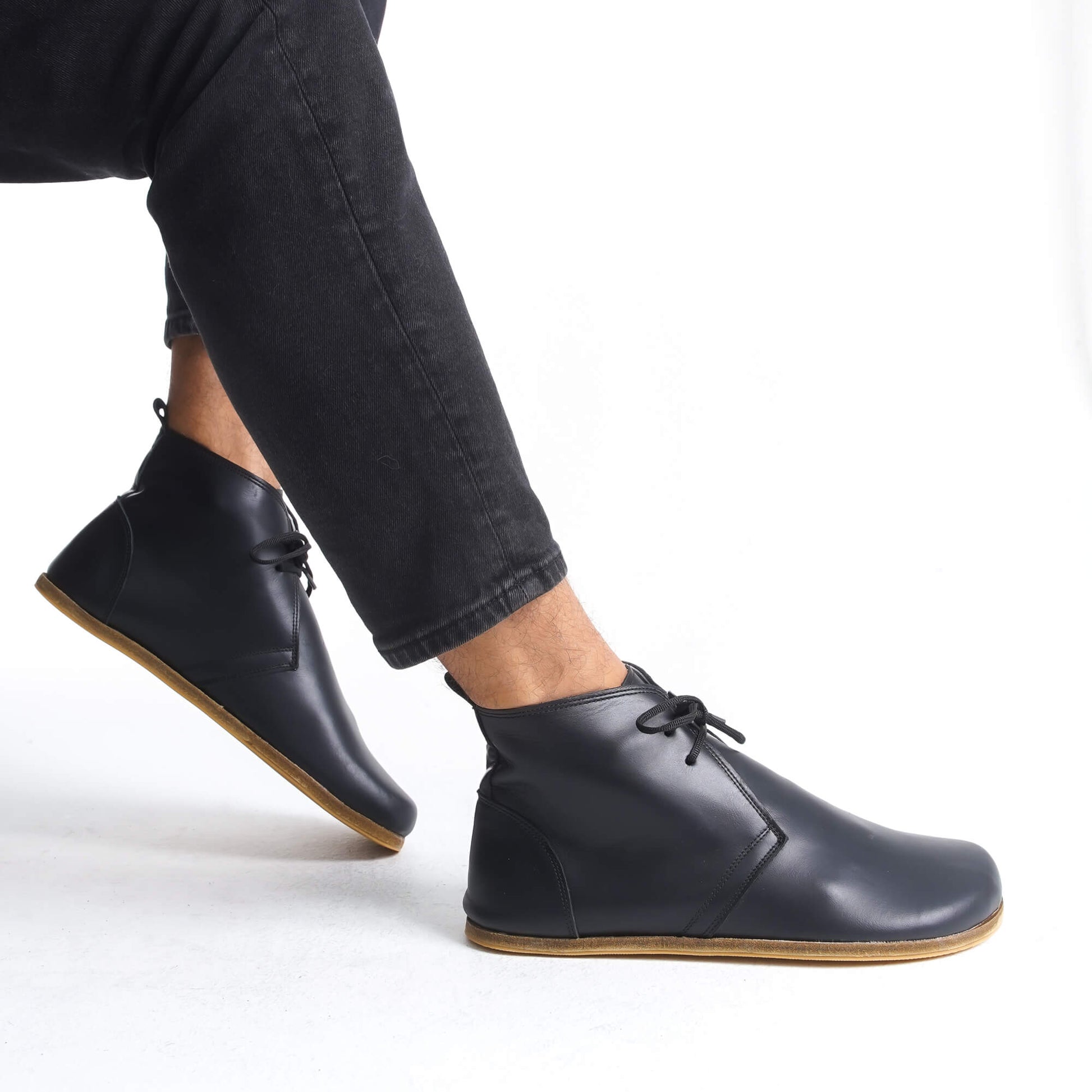 Black barefoot leather ankle boots with flexible zero-drop design, perfect for a health-focused, minimalist lifestyle and daily wear