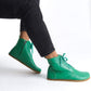 Stylish green barefoot winter boots that make a bold statement. Featuring a sleek design and flexible sole, they provide exceptional comfort while keeping your feet warm and cozy in colder weather.