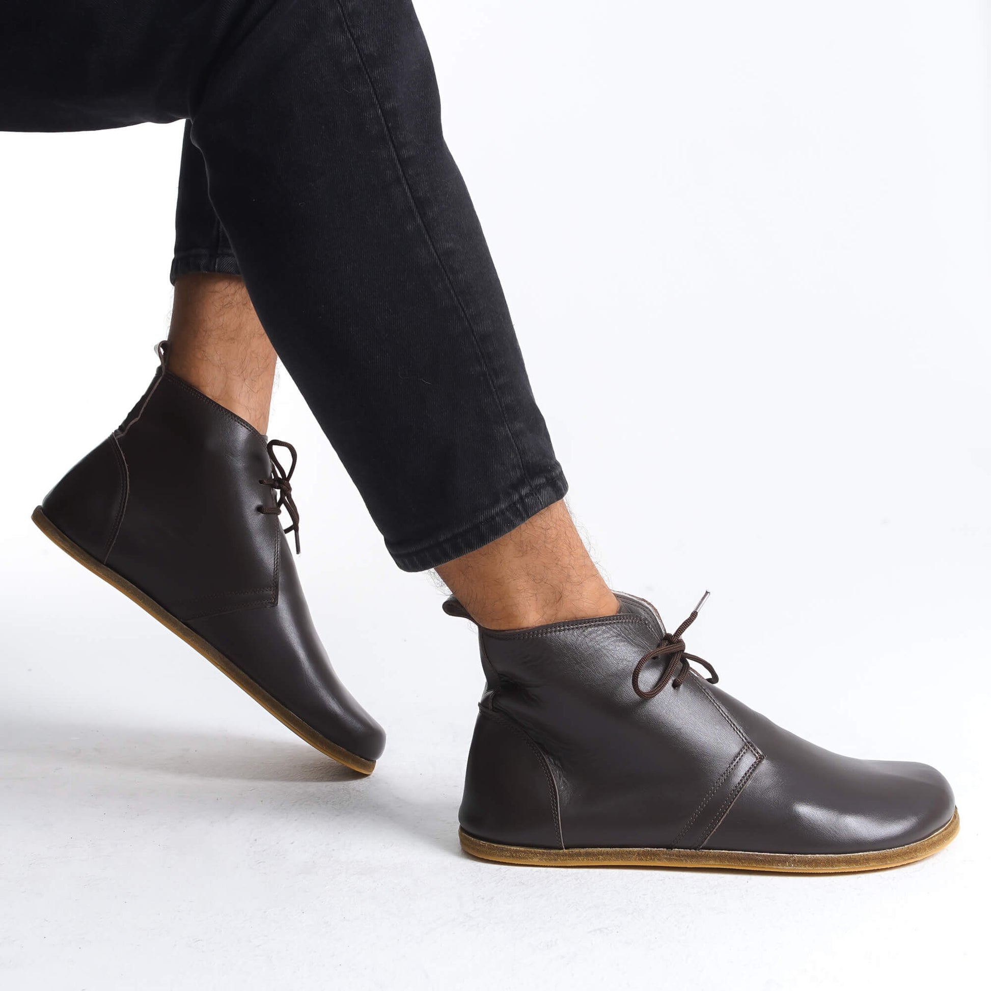 Step into nature with our minimalist leather boots. Feel the ground beneath your feet with our flexible sole. #minimalfashion #nature #flexible #leather