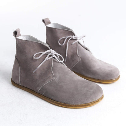 Minimalist gray leather barefoot boots with a zero-drop sole, designed for natural foot movement.