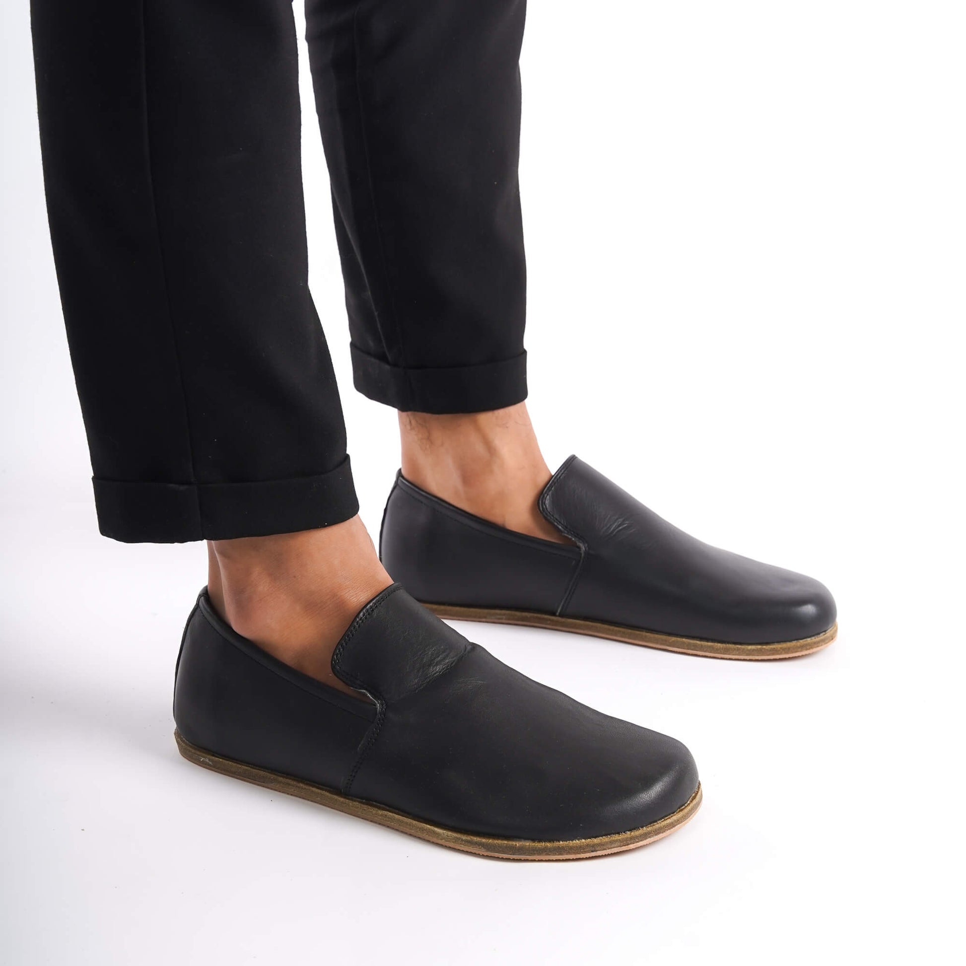 Close-up of Aeolia Leather Barefoot Men Loafers in black worn with black pants - shop at pelanir.com.