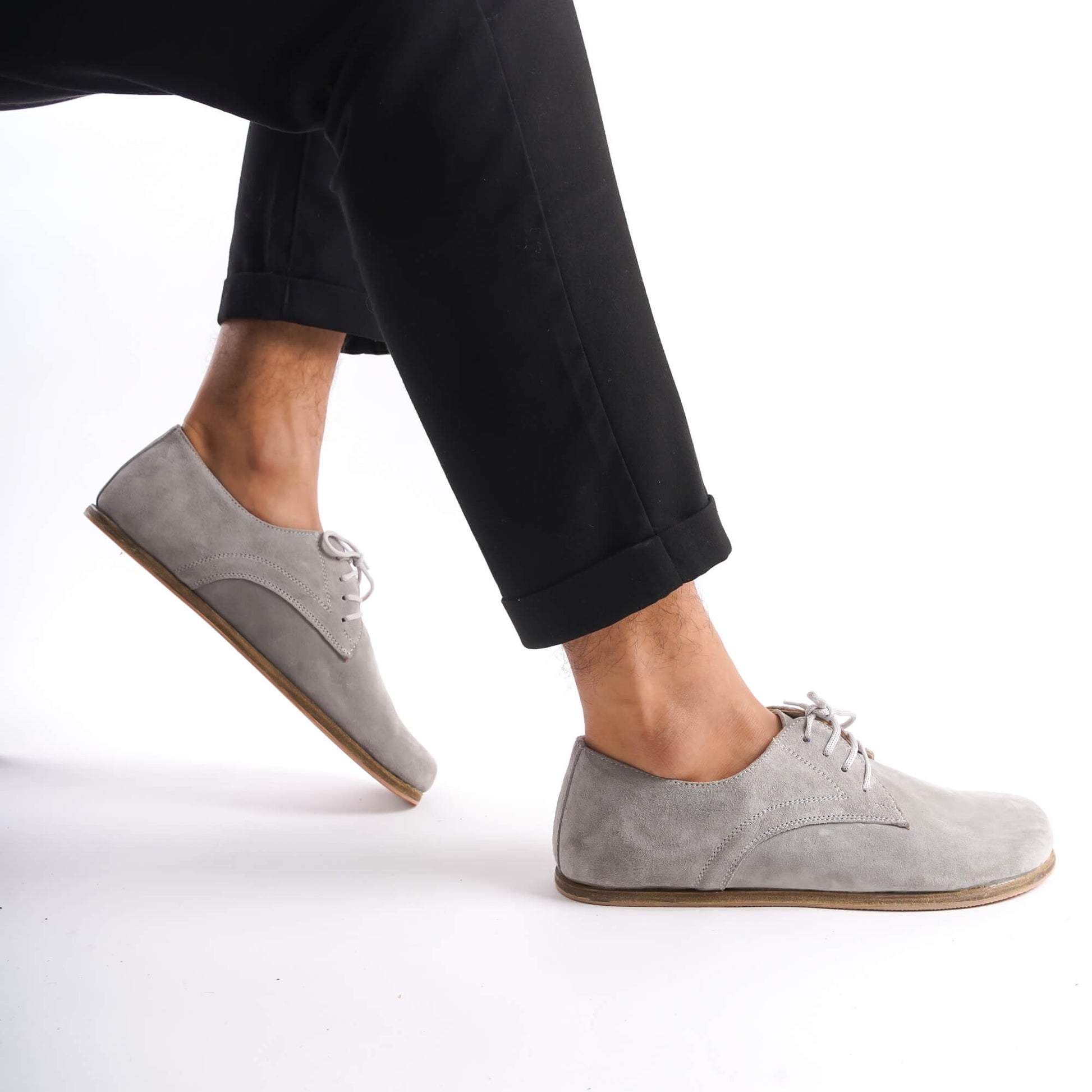 Close-up of Locris Leather Barefoot Men's Oxfords in gray suede, featuring genuine leather and a wide toe box for comfort.