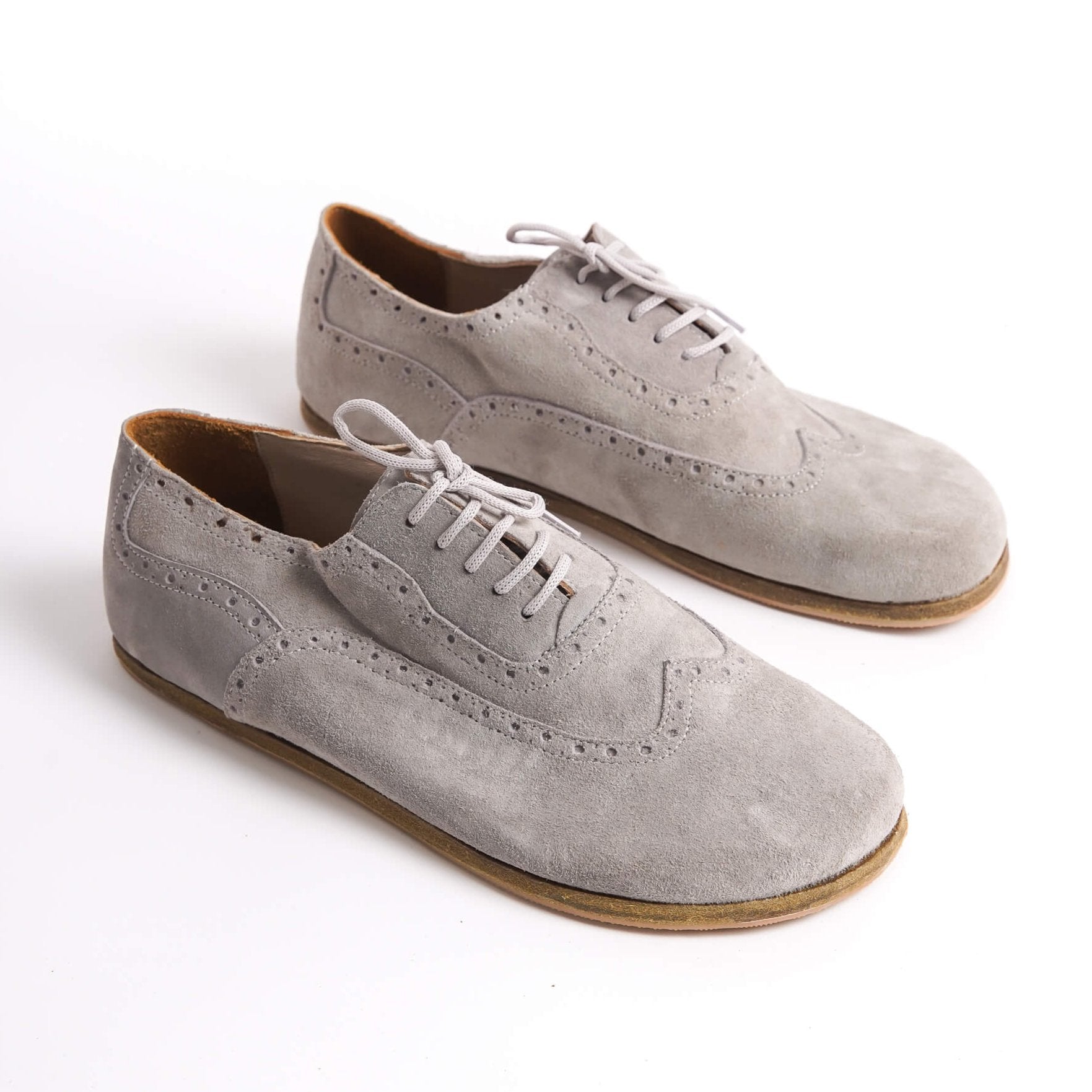 Elegant gray suede barefoot Oxfords with brogue details for men – stylish and comfortable.