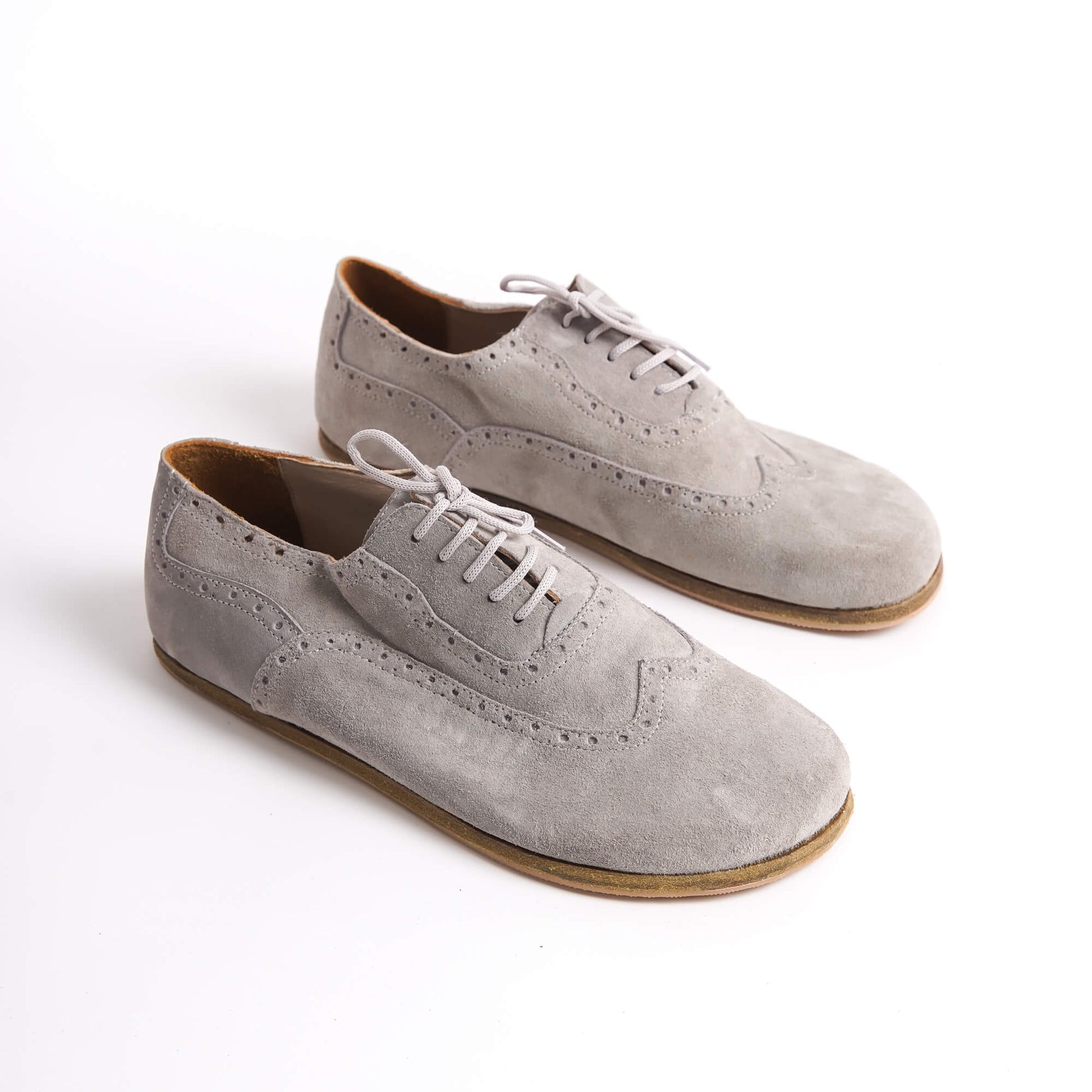 Elegant gray suede barefoot Oxfords with brogue details for men – stylish and comfortable.