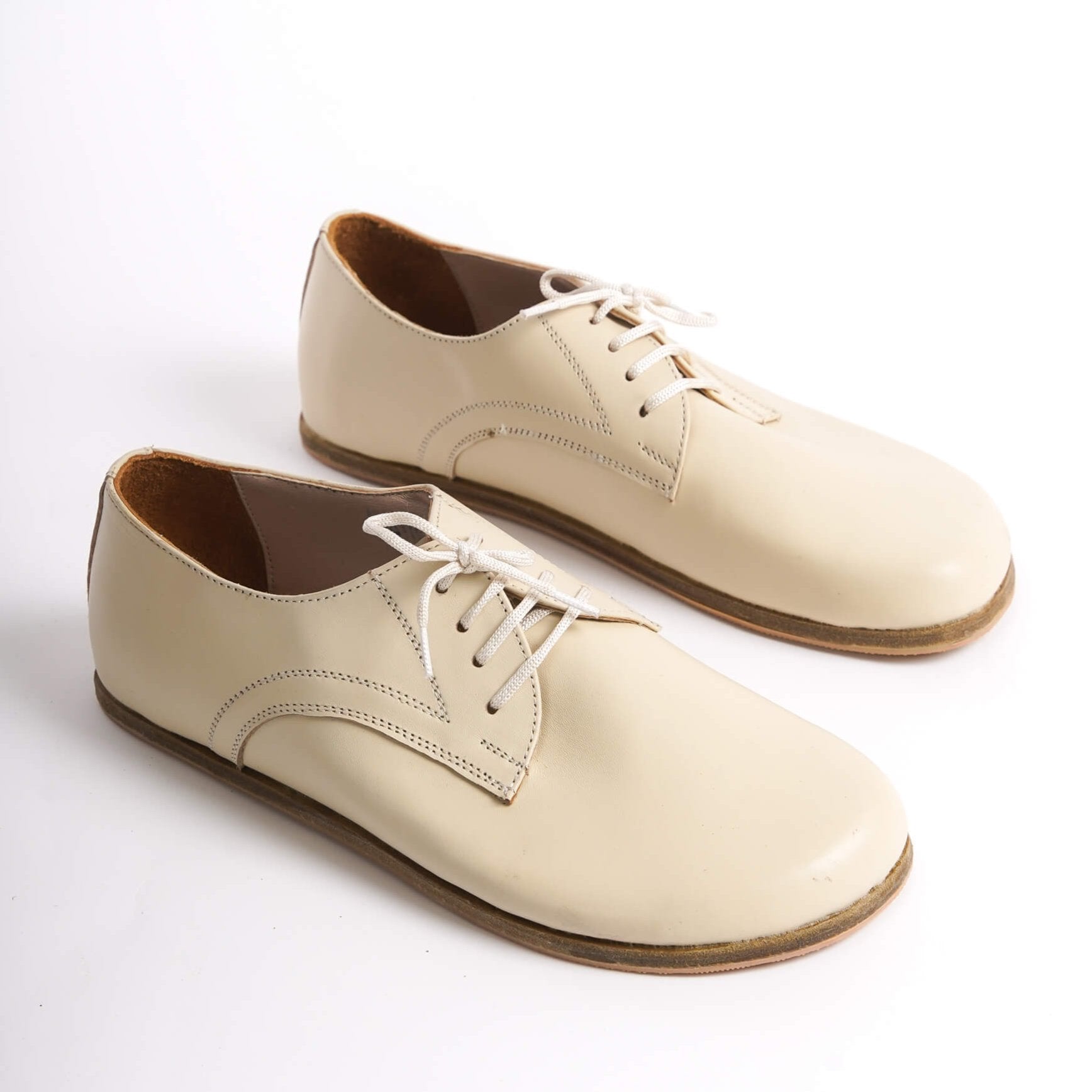 Elegant beige Locris Leather Barefoot Oxfords for women – minimalist and stylish design.