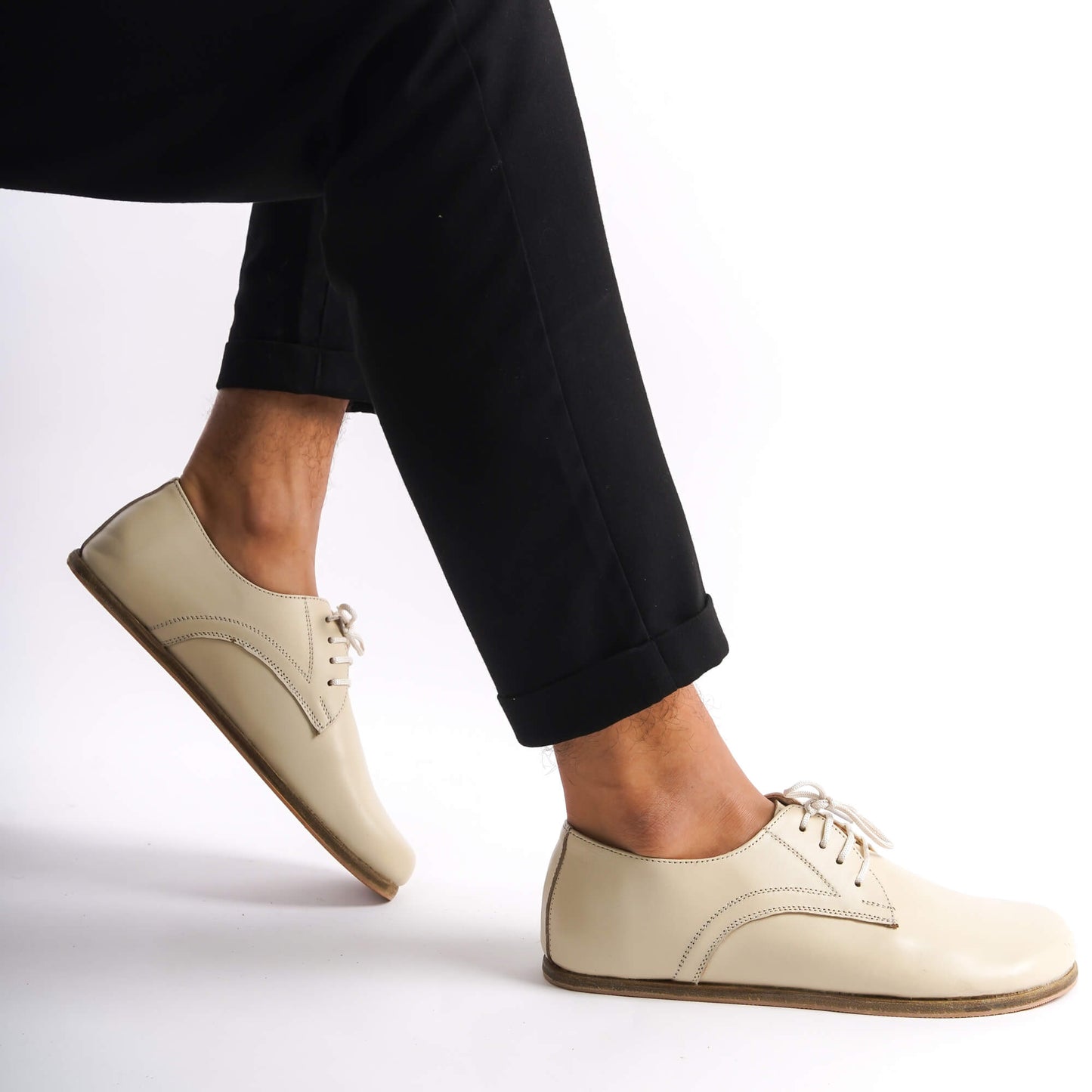 Close-up of beige Locris Leather Barefoot Oxfords showcasing clean design and natural foot shape.