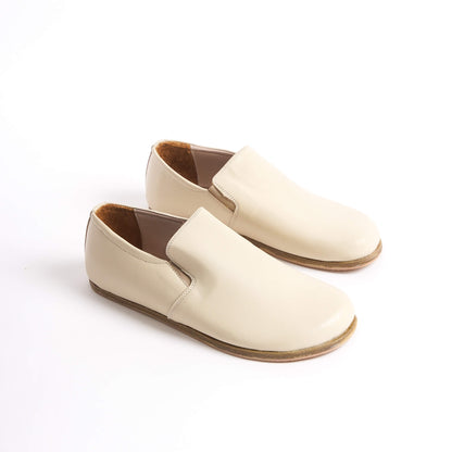 Close-up of Ionia Leather Barefoot Men Loafers in beige, highlighting the slip-on design and flexible sole.