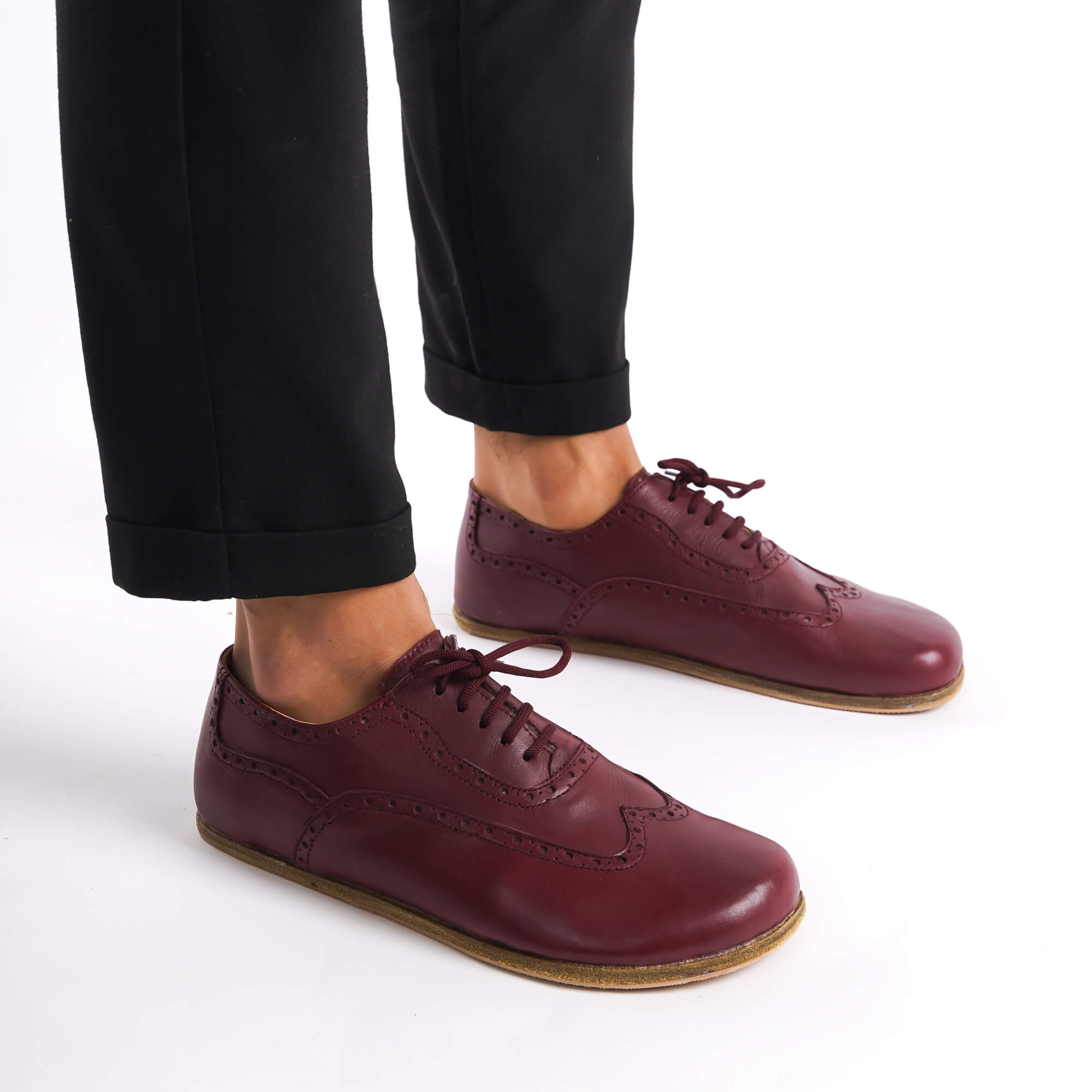 Stylish burgundy Doris barefoot Oxfords paired with jeans – modern, comfortable, and versatile footwear.