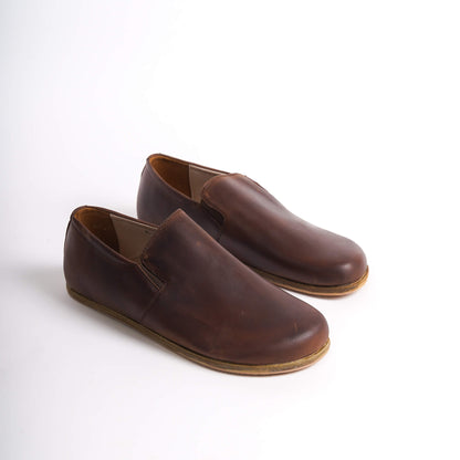 Pair of brown Ionia Leather Barefoot Men Loafers showcasing a sleek, minimalist design with premium leather finish.