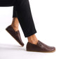 Side view of a man’s feet in brown Ionia Leather Barefoot Men Loafers, highlighting the flexible sole and natural movement.