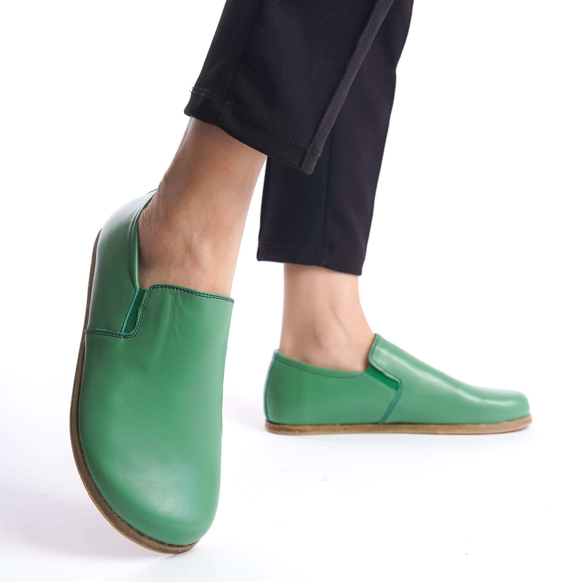 Ionia green leather barefoot loafers on feet - side view. Shop for genuine leather shoes at Pelanir.