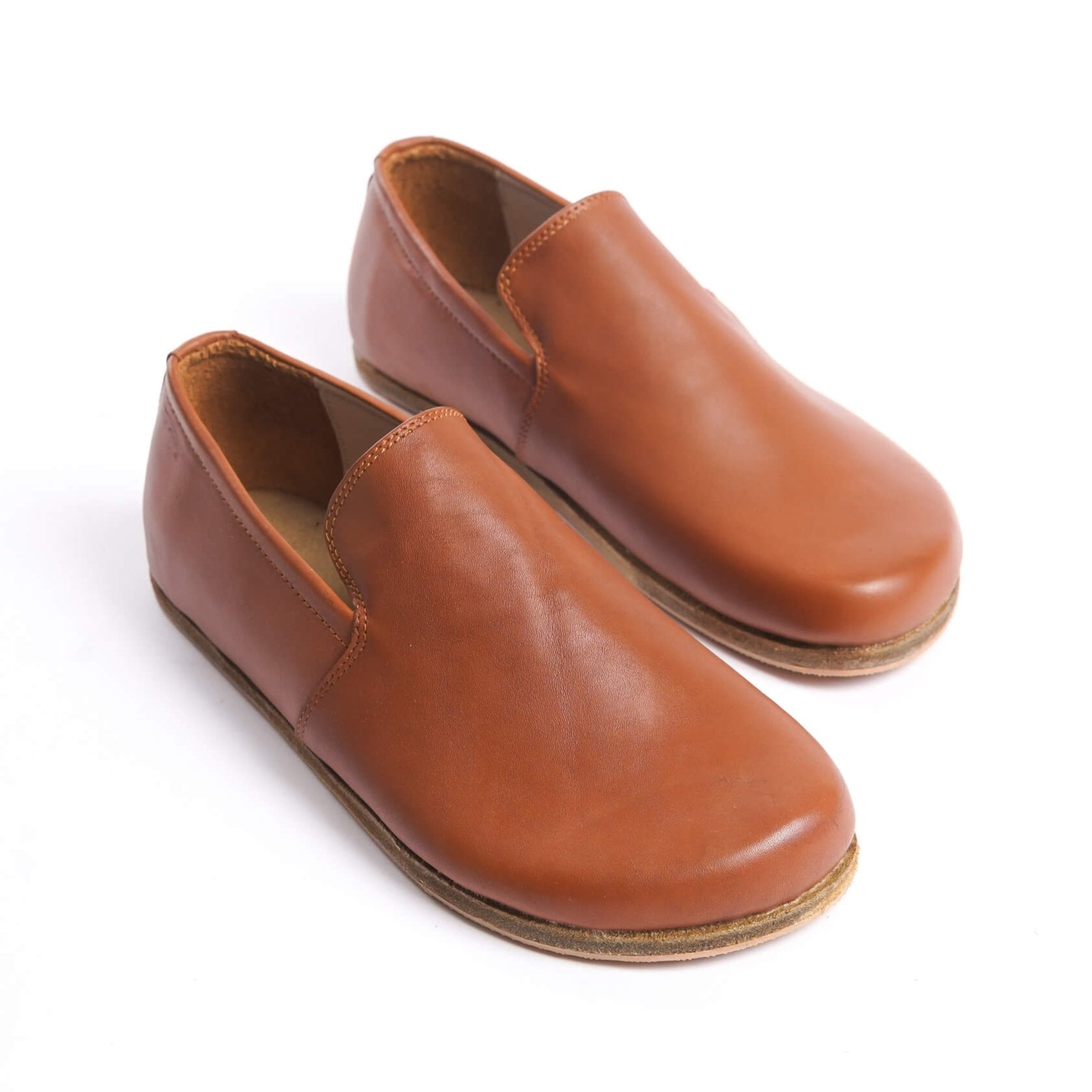 Aeolia tan brown leather barefoot women loafers, featuring a minimalist and comfortable design.