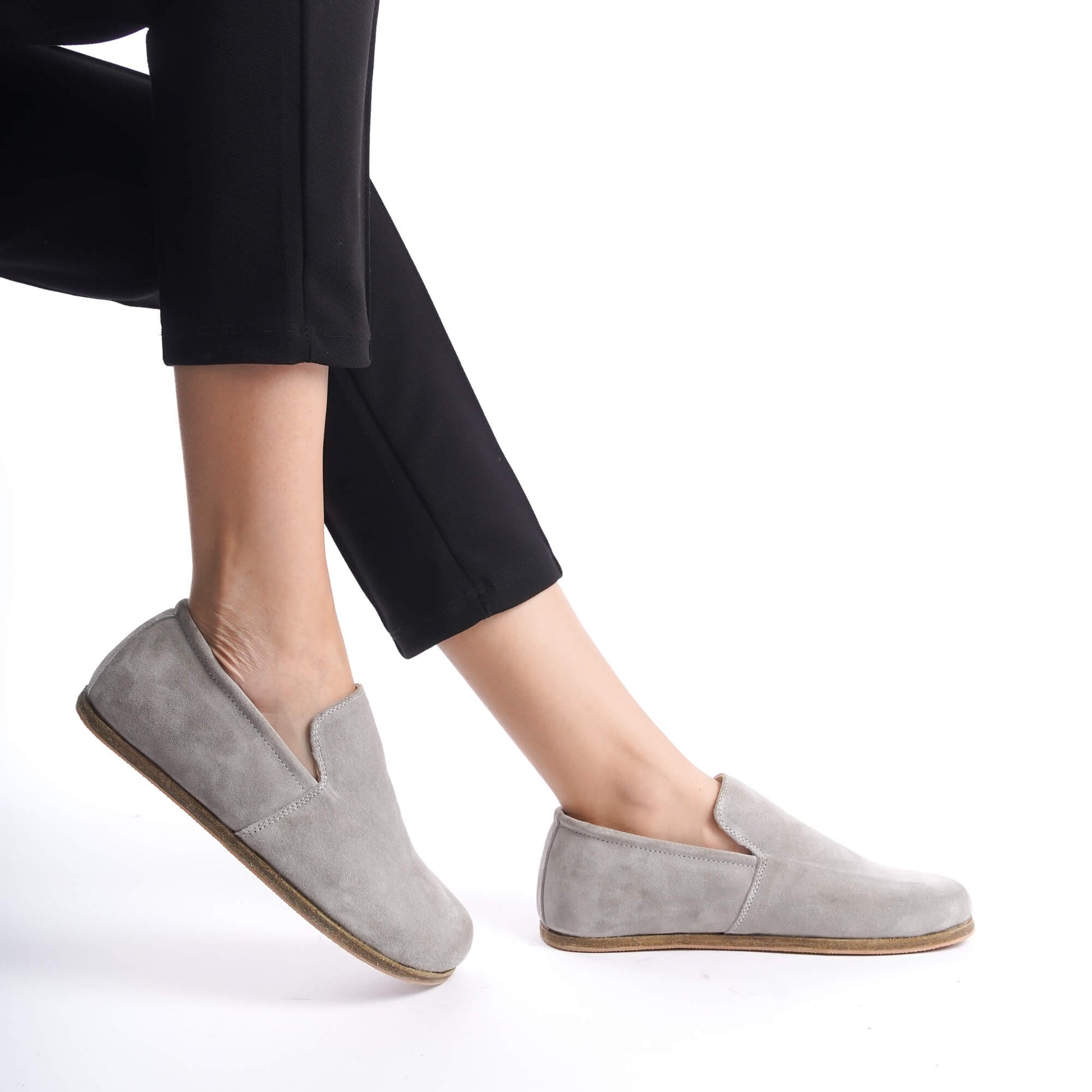 Aeolia gray suede barefoot women loafers, paired with black pants, featuring a minimalist and comfortable design.