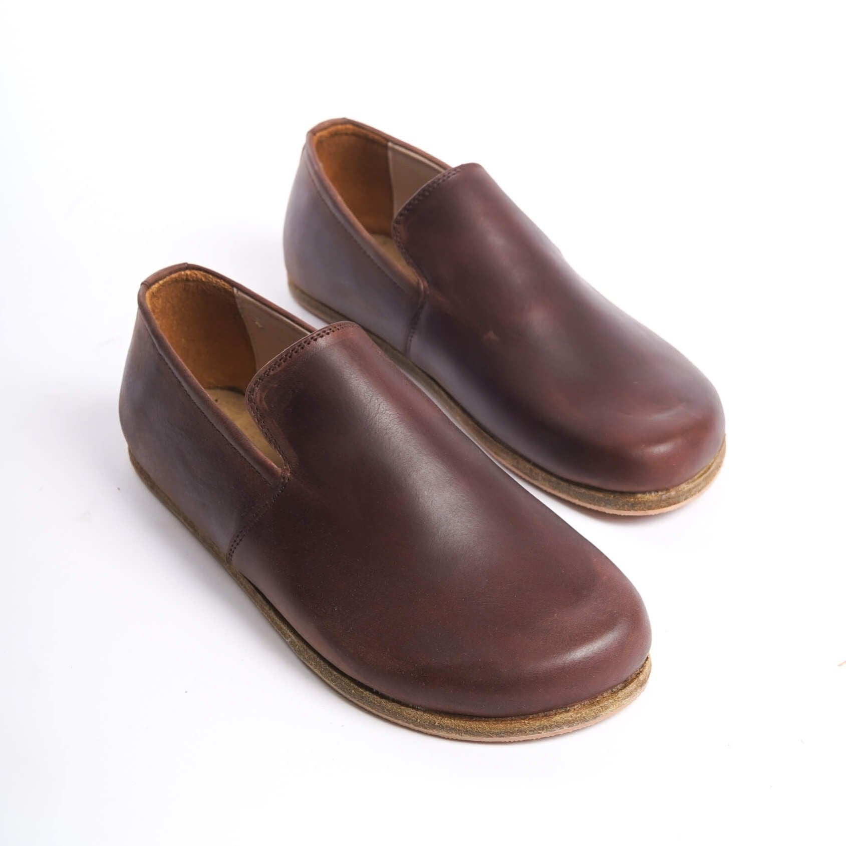 Pair of Aeolia Leather Barefoot Women Loafers in Brown - Top view highlighting the smooth genuine leather finish.