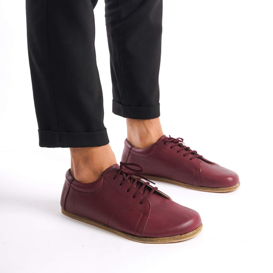 Lydia Leather Barefoot Men's Sneakers paired with black pants, highlighting the versatile and modern design.