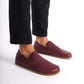 Burgundy Aeolia Leather Barefoot Men's Loafers with a zero-drop sole, shown on feet with black pants for a sleek look.