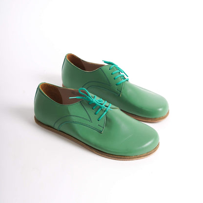 Locris Leather Barefoot Men's Oxfords in green, displayed side by side, highlighting their vibrant color and genuine leather.