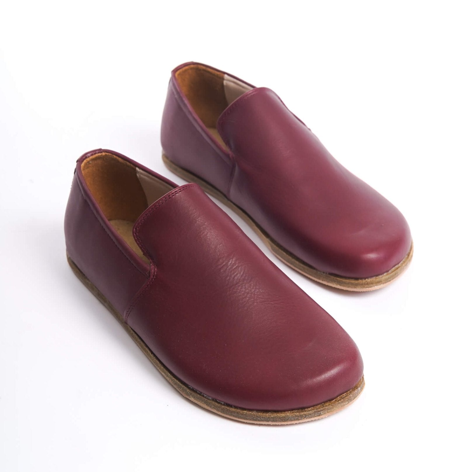 Pair of Aeolia Leather Barefoot Women Loafers in Burgundy - Top view highlighting the smooth genuine leather finish.