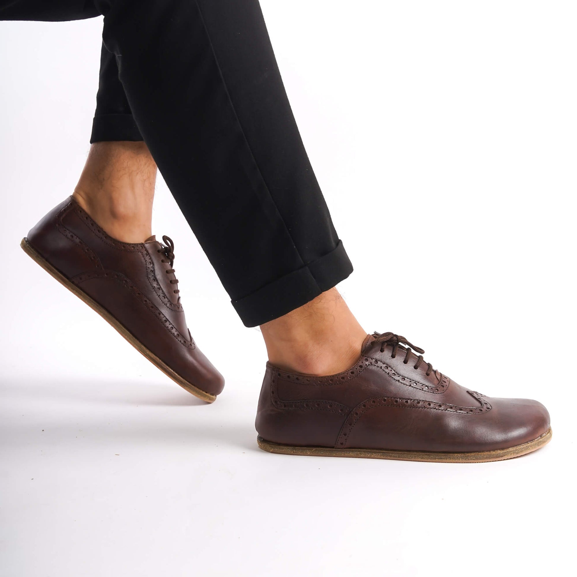 Brown Doris Leather Barefoot Men's Oxfords on feet, highlighting their flexibility and minimalist design.