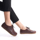 Side view of brown Locris leather barefoot women Oxfords being worn, highlighting the natural fit and comfort. Discover more at pelanir.com.