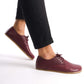 Close-up of Locris Leather Barefoot Men's Oxfords in burgundy, showcasing their sleek design and minimalist style.