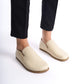 Ionia beige loafers worn with white pants and light socks - Add elegance with Ionia Leather Barefoot Women Loafers in beige.