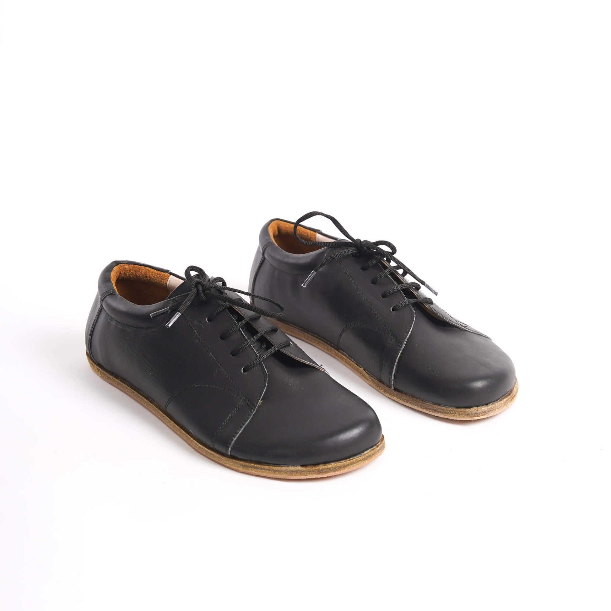 Black Lydia Leather Barefoot Men's Sneakers with lace-up design, made from genuine leather for superior comfort and durability.