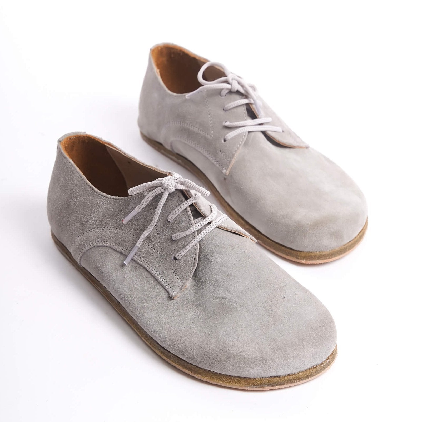 Gray suede Locris leather barefoot women oxfords with white laces, showcasing a minimalist and natural design.