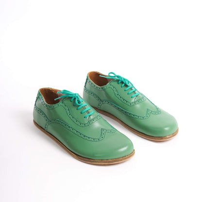 "Elegant green Doris Leather Barefoot Oxfords with brogue details for men – stylish and comfortable.