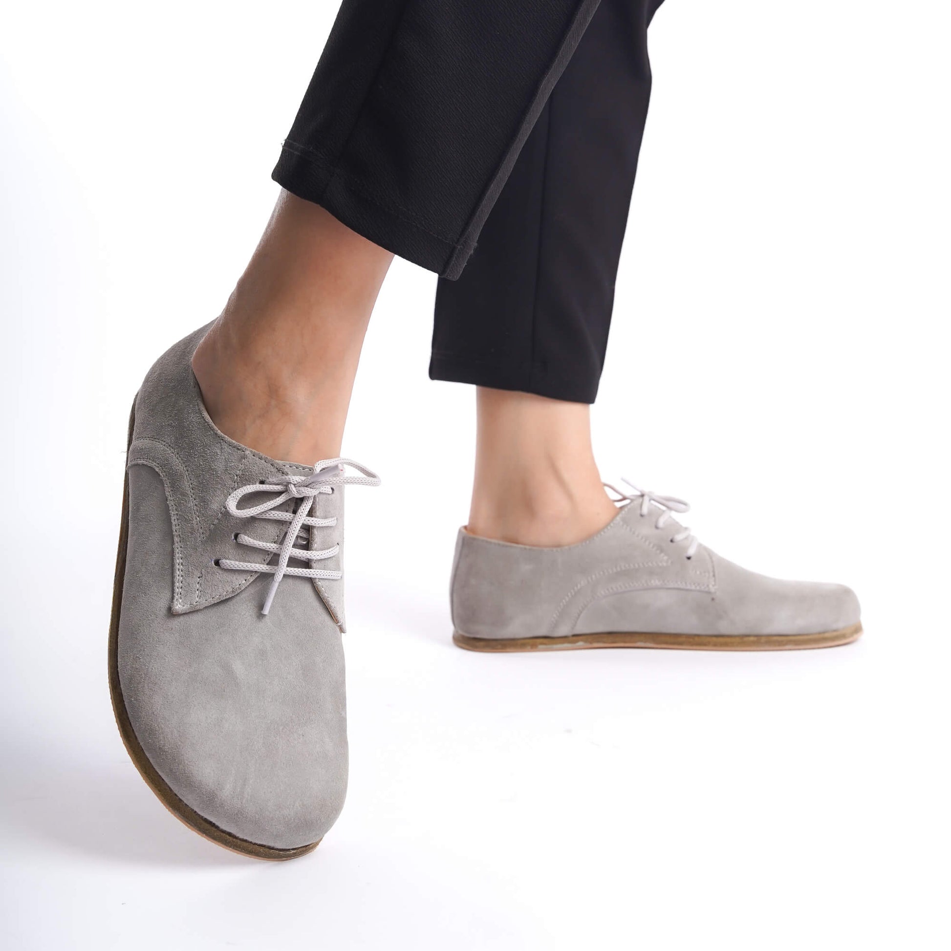 Close-up of gray suede Locris leather barefoot women oxfords, highlighting their flexible sole and natural fit.