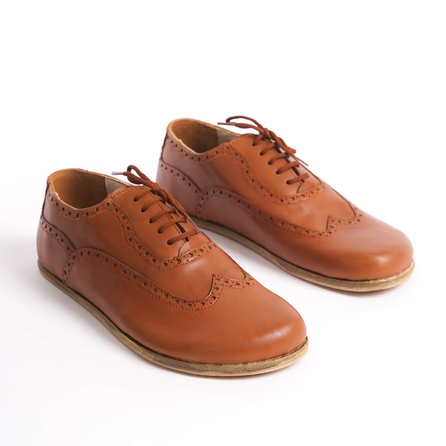 Elegant tan brown Doris Leather Barefoot Oxfords with brogue details for men – stylish and comfortable.