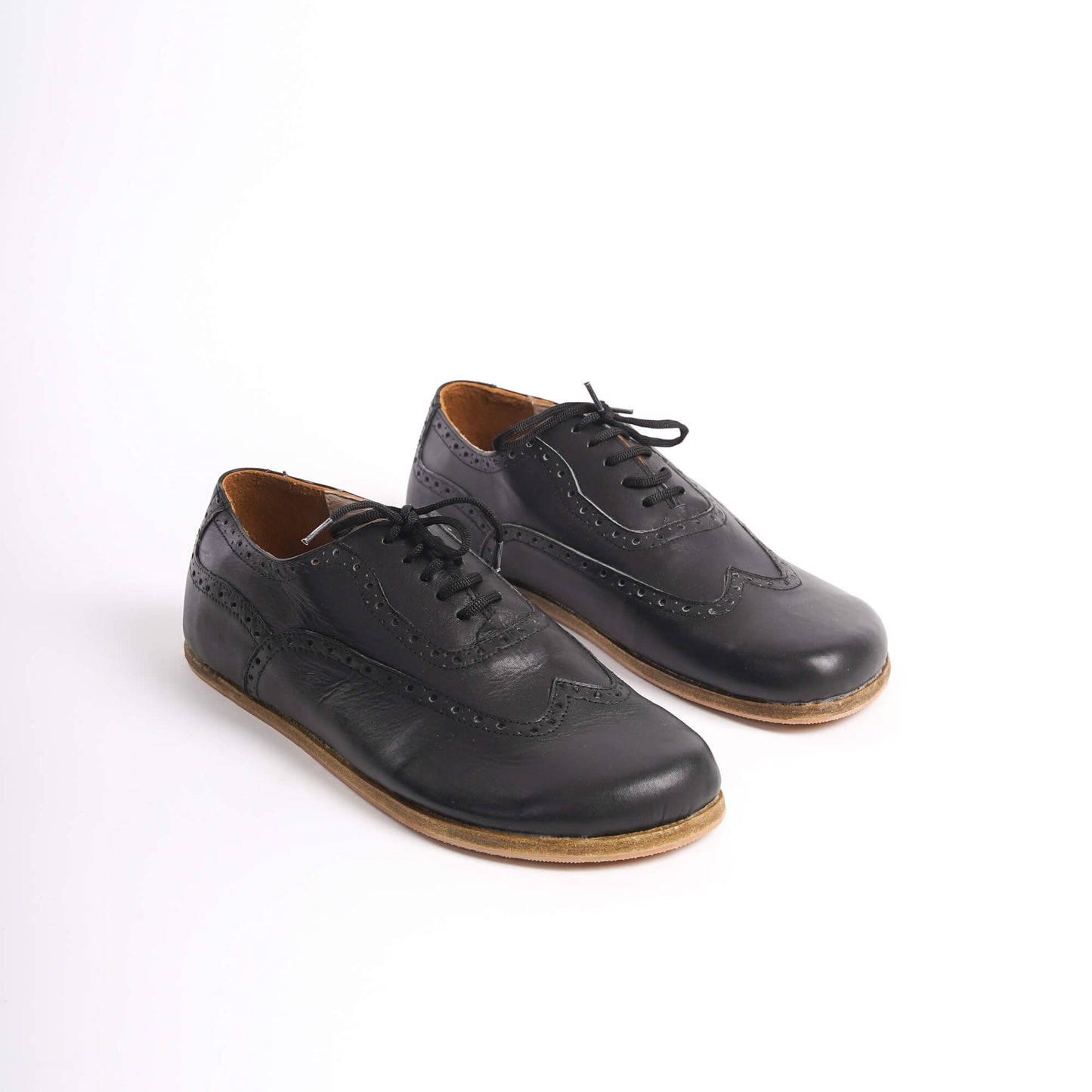 Classic black Doris Leather Barefoot Men's Oxfords with intricate brogue detailing and zero-drop sole for natural foot movement.