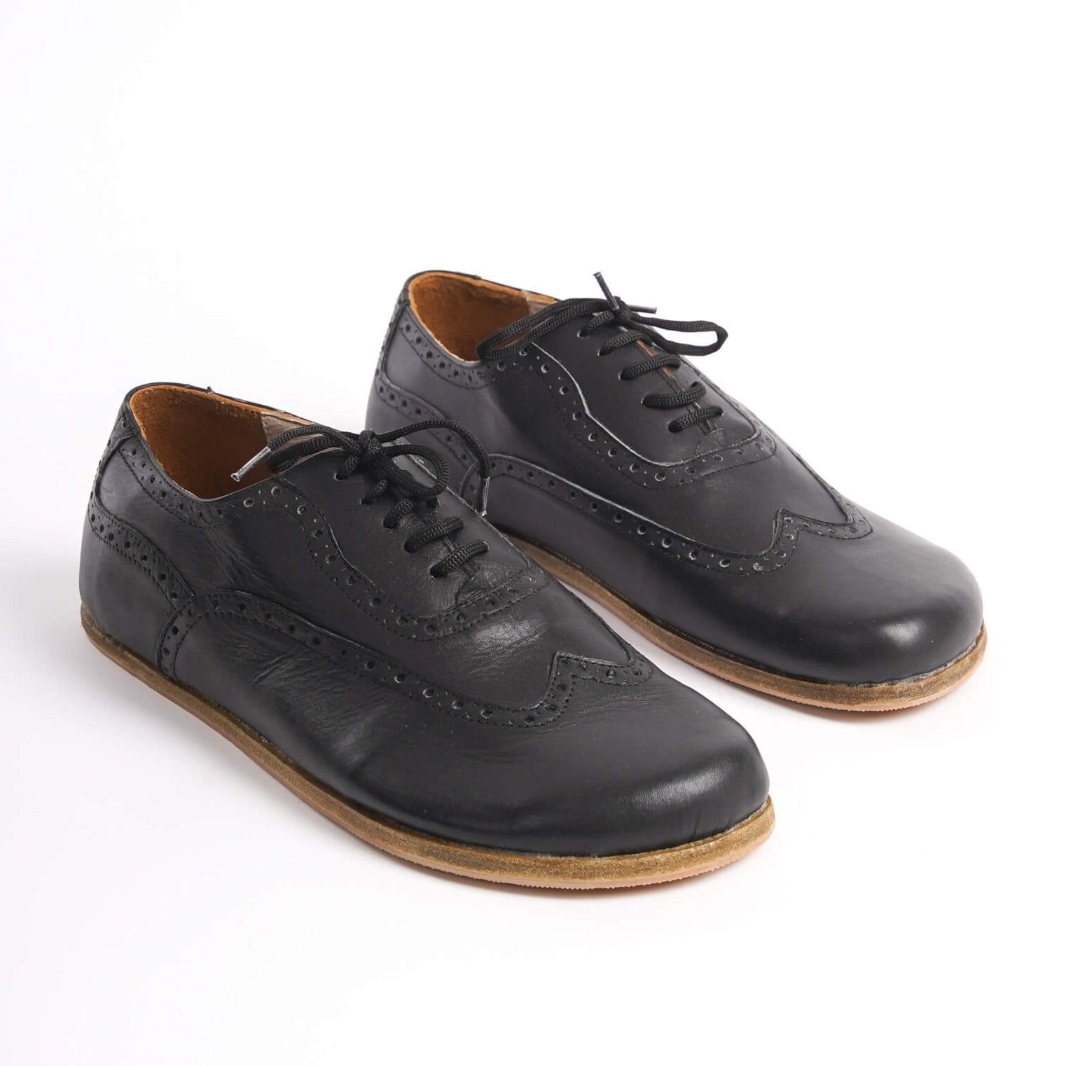 Classic black Doris Leather Barefoot Men's Oxfords with intricate brogue detailing and zero-drop sole for natural foot movement.