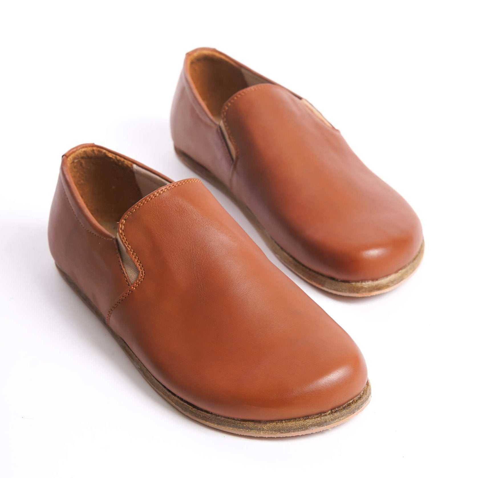 Ionia leather barefoot women loafers in tan brown, showcasing their sleek design and genuine leather craftsmanship.