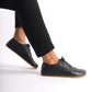 Black Doris Leather Barefoot Men's Oxfords on feet, highlighting their flexibility and minimalist design.