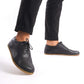 Black Doris Leather Barefoot Men's Oxfords on feet, emphasizing their zero-drop design and natural foot health benefits.