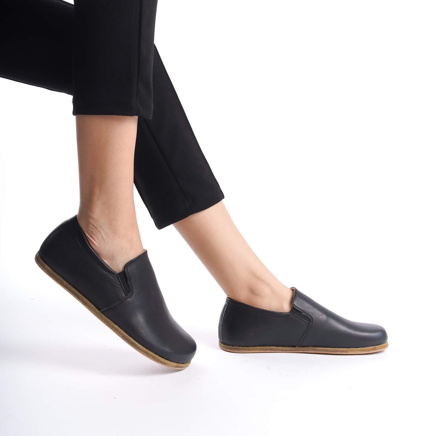 Ionia Black Leather Loafers - Side View in Motion