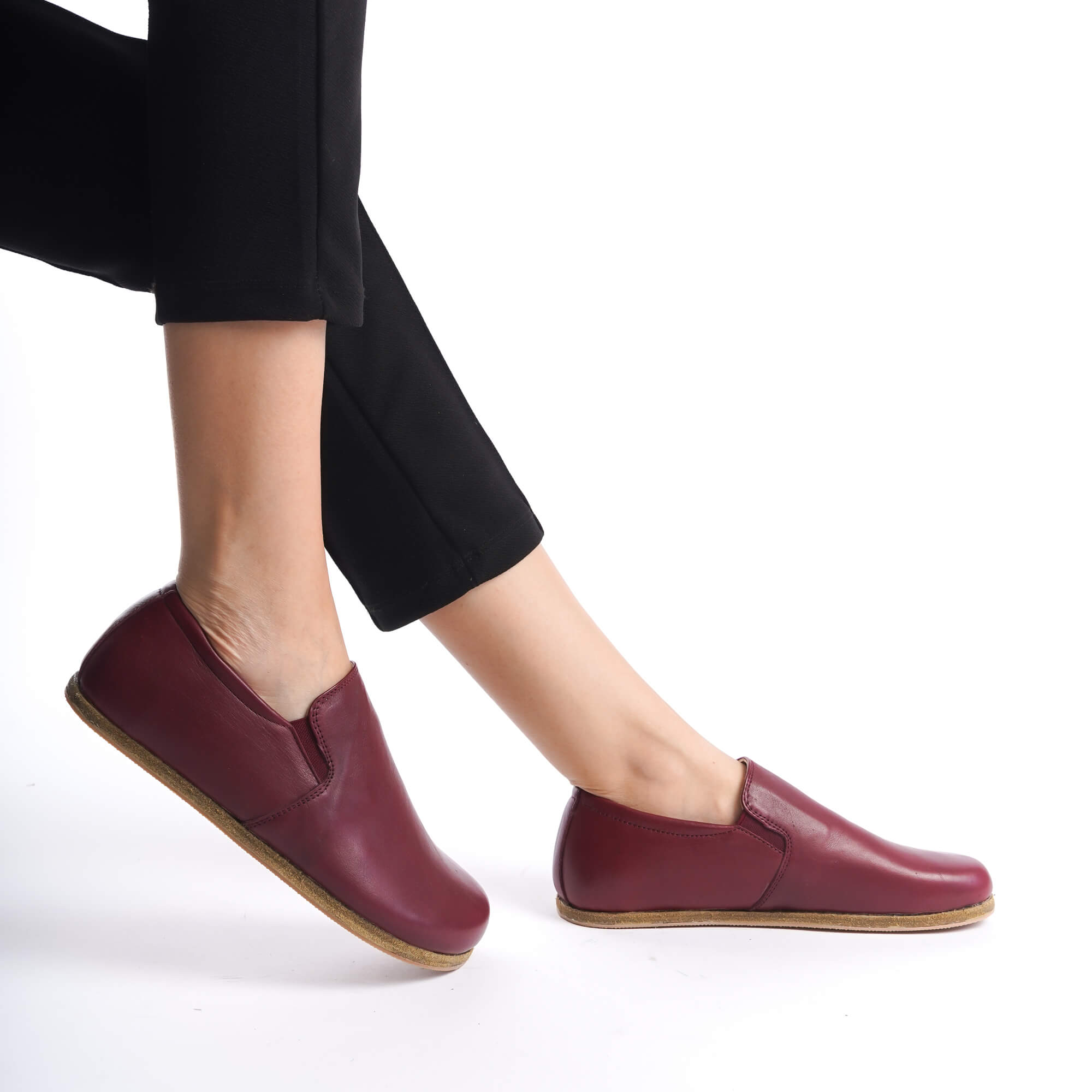 Close-up of Ionia Burgundy loafers, highlighting minimalist, zero-drop design.