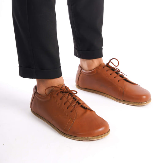 Image of tan brown Lydia Leather Barefoot Men's Sneakers, perfect for everyday wear and comfort.