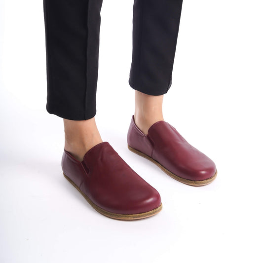 Side view of Burgundy Ionia loafers emphasizing wide toe box and genuine leather.